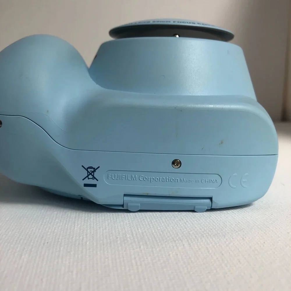 Blue instax mini 7s Polaroid camera